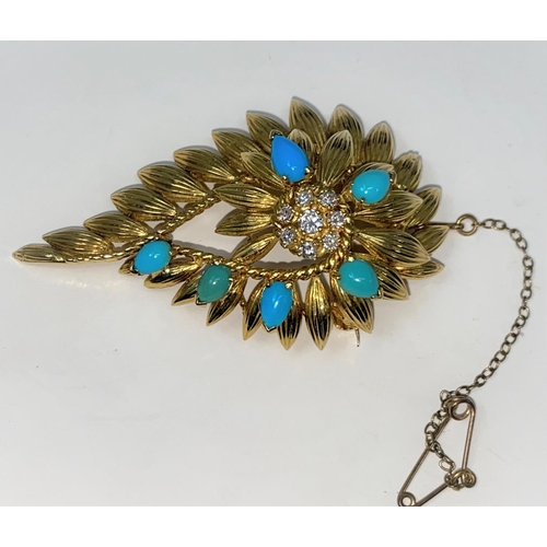 293 - A turquoise and diamond brooch in the form of a flower head surrounded by leaves, in 18 carat hallma... 