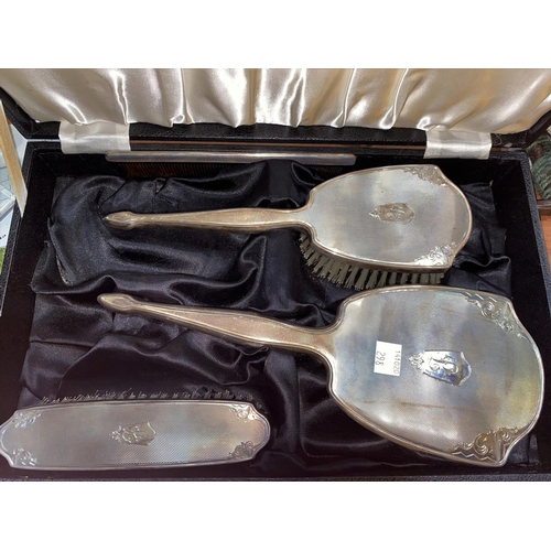 298 - A hallmarked silver 3 piece dressing table set , engine turned and monogrammed, Birmingham 1959
