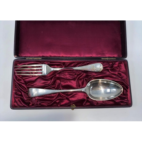 314 - A cased monogrammed hallmarked silver table spoon and fork, London 1899, 3.5oz