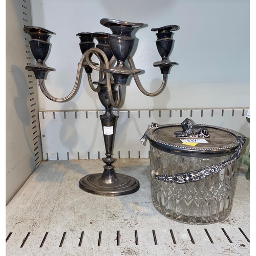 347 - A silver plated candelabra: a glass and silver plated biscuit barrel (handle af)