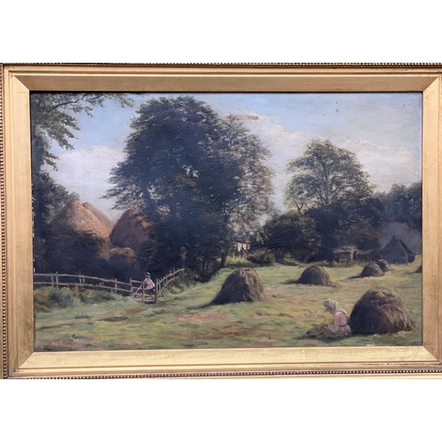 464 - A Victorian oil on canvas of a girl in a field sewing near a hay stack, unsigned in a gilt frame