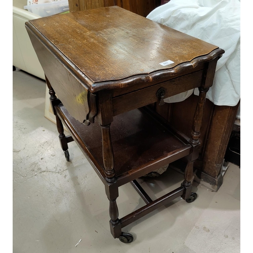 503 - A oak drop leaf trolley on turned legs, with pie crust edges & single drawer; a circular occasional ... 