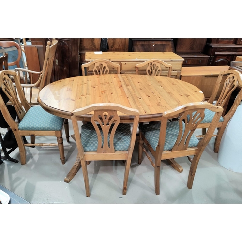 511 - A modern pine dining suite comprising twin pedestal extending table, 6 chairs and sideboard of 3 cup... 