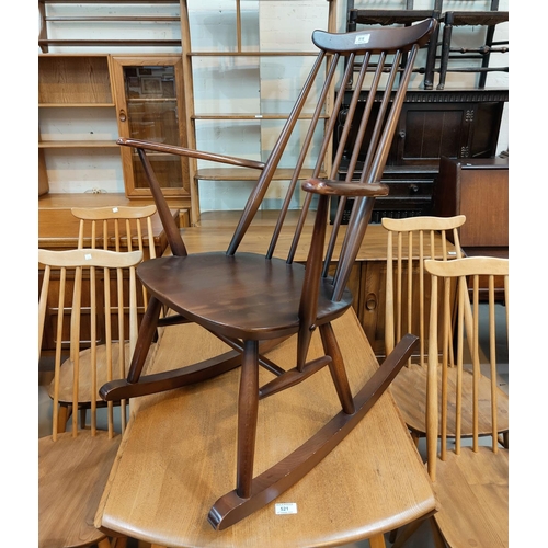 516 - An Ercol style stick back rocking chair