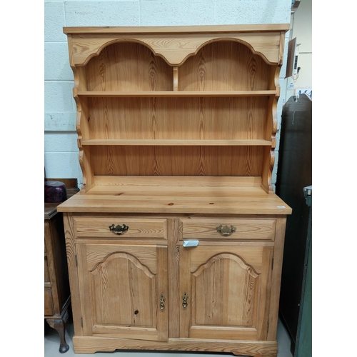 541 - A modern pine dresser with double cupboards and drawers bellow
