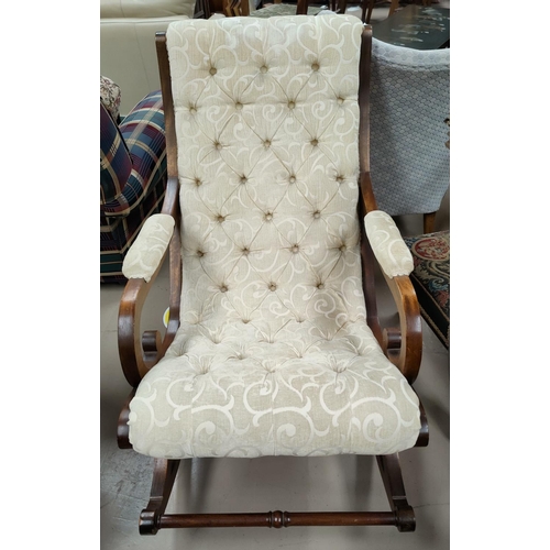 579 - A Victorian scroll arm rocking armchair and another chair