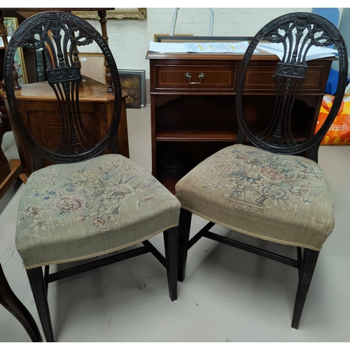 581a - An Adam style pair of carved mahogany salon chairs with oval backs and tapestry seats