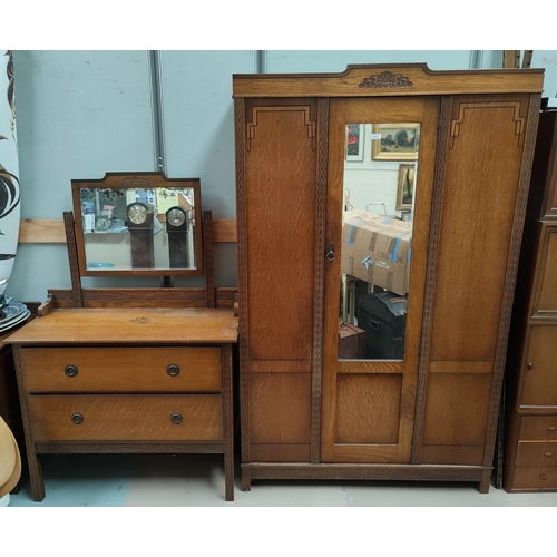 617 - A 1930's Oak three piece bedroom suite comprising oak single mirror door wardrobe, two height dressi... 