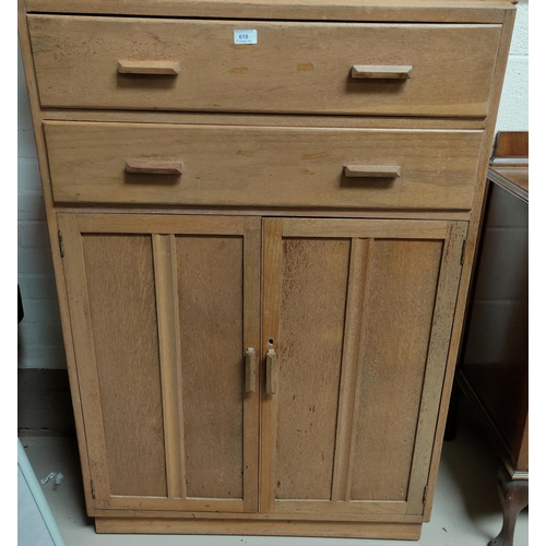 618 - A limed Oak tall boy with two drawers and double cupboard below