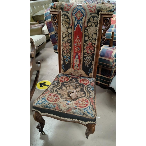 641 - An Victorian oak panel tapestry nursing chair on Knurled feet (1 leg af)