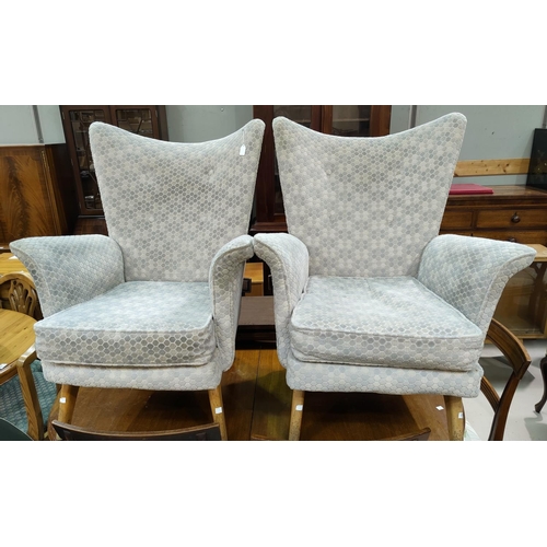 621 - A pair of early 1950's Parker Knoll armchairs (leather upholstery)