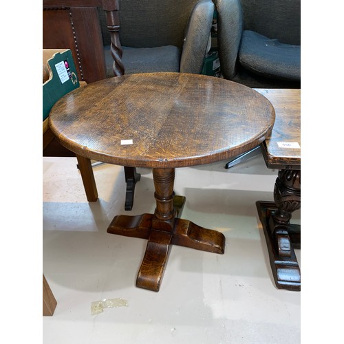 508 - A distressed oak pedestal occasional table with circular top