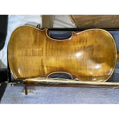 519 - A German Stainer pattern violin, two piece back, 35.7cm back with bow, cased