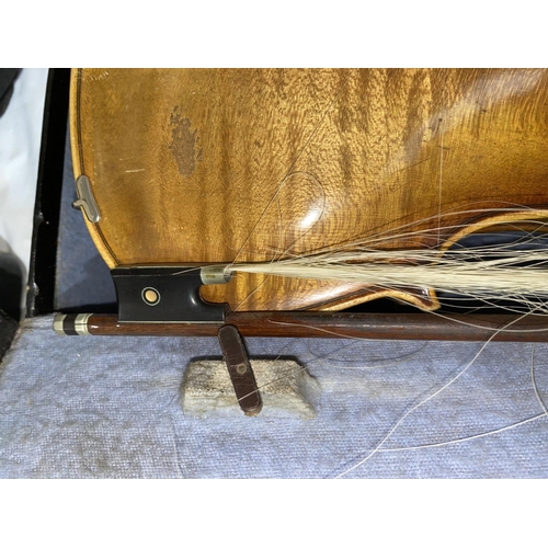 519 - A German Stainer pattern violin, two piece back, 35.7cm back with bow, cased