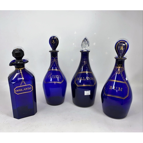204 - A Georgian near matching set of 3 decanters in Bristol blue, lettered in gilt, 2 x Rum, 1 x Hollands... 