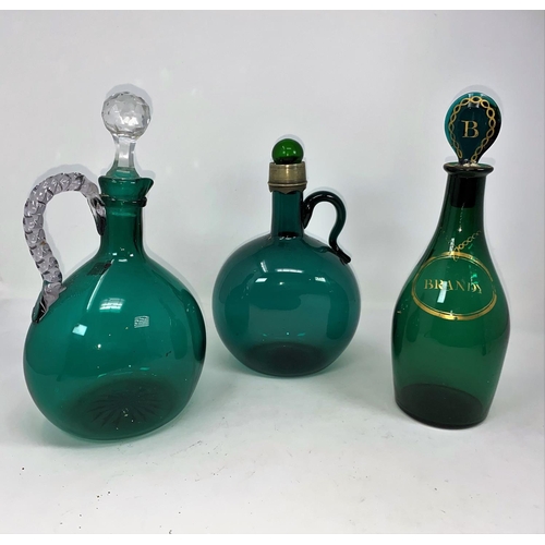 205 - Two 19th century green glass claret jugs; a green 'Brandy' decanter; a turquoise glass wine jug