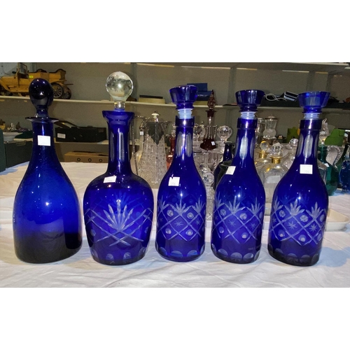 206 - A modern set of 3 decanters, overlaid blue; 2 similar decanters
