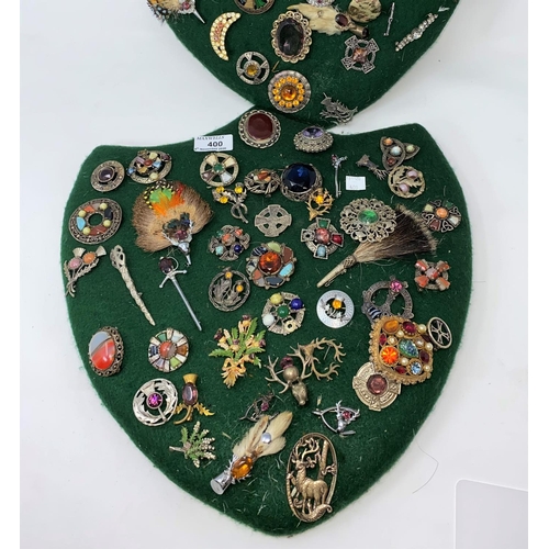 400 - A collection of Scottish brooches, etc., mounted on 2 felt pads
