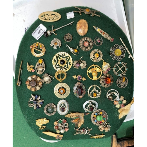 401 - A collection of Scottish brooches, etc., mounted on 3 felt pads