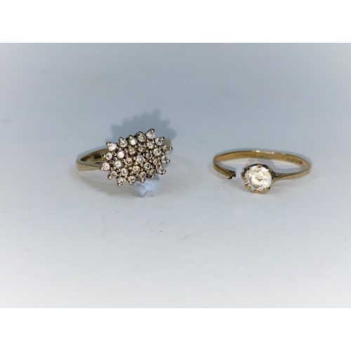 339 - A 9 carat gold dress ring set 29 diamond chips, approx, stamped '375'; a 9 carat gold ring set clear... 