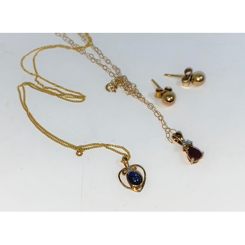 341 - A yellow metal pendant set sapphire, on 9 carat gold chain; a 9 carat gold drop set ruby on 9 carat ... 