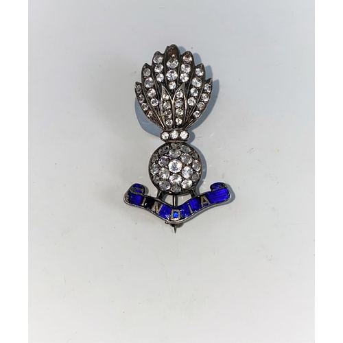 394 - A Royal Fusiliers India brooch, set white cut stones, in blue enamel mount