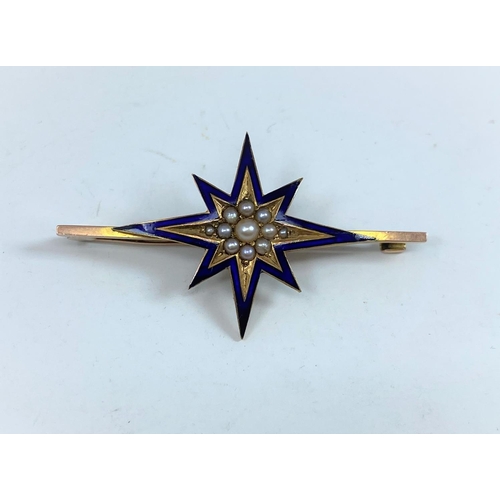 414 - An Edwardian 'star' bar brooch in yellow metal and blue enamel, set seed pearls, unmarked, tests as ... 