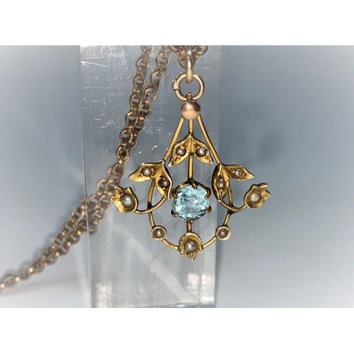 381 - A Art Nouveau aquamarine coloured and seed pearl pendant, on plated chain