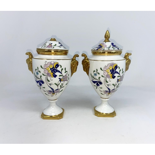 162 - A pair of Coalport covered vases, (one finial a/f) and a  decorated plates.
sold with next lot