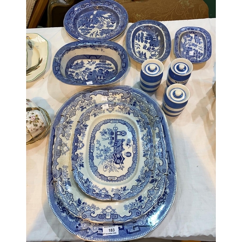 183 - A large willow pattern meat plate; other blue & white war; 3 small Cornish Kitchen storage jars by T... 