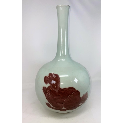 274 - A Chinese ceramic slim neck bottle vase decorated with red glaze temple dogs, height 40cm (chipping ... 