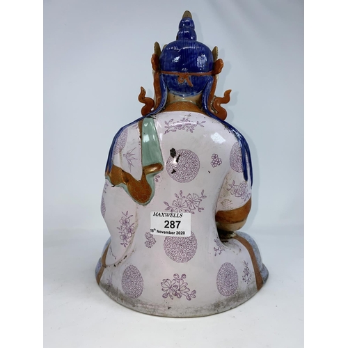 287 - A Chinese ceramic figure of a seated buddha in Lots position, height 30cm