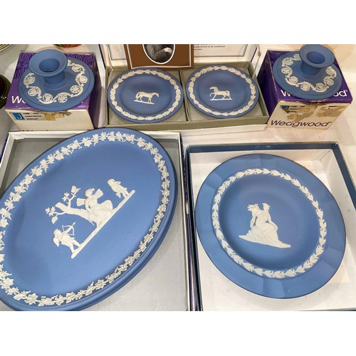 168 - Two blue Wedgwood dishes, 2 smaller dishes and a pair of candle holders