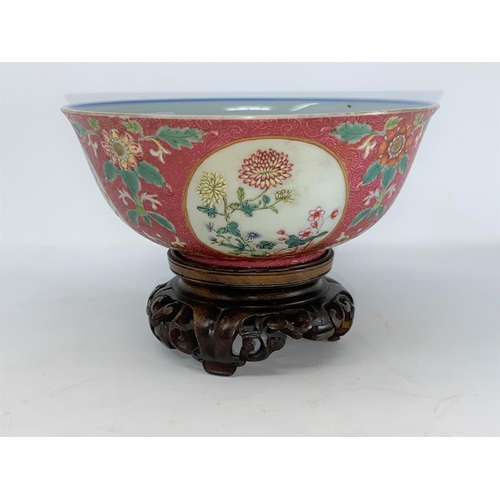 269 - A Chinese famille rose bowl with floral panel decoration to the outer and blue and white interior, m... 