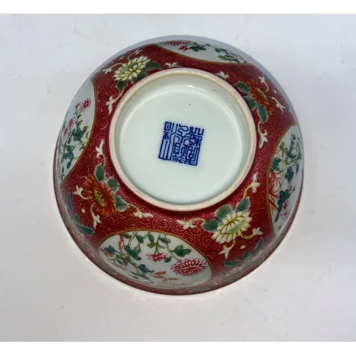 269 - A Chinese famille rose bowl with floral panel decoration to the outer and blue and white interior, m... 