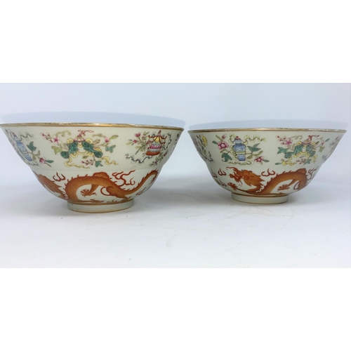 276 - A pair of Chinese bowls finely decorated with dragons, vases etc, light blue interior and bases, wit... 