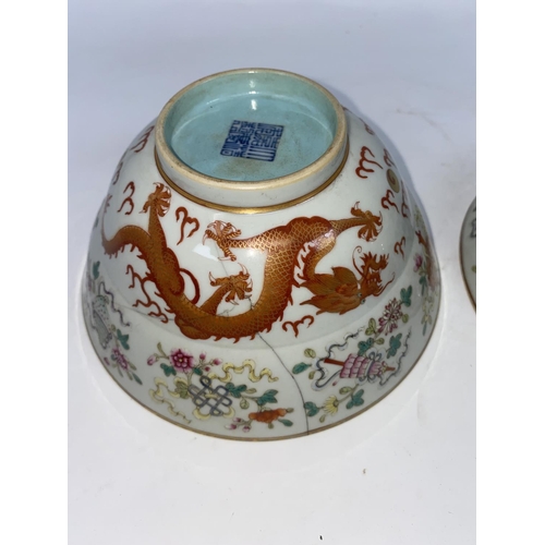 276 - A pair of Chinese bowls finely decorated with dragons, vases etc, light blue interior and bases, wit... 