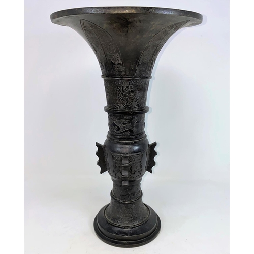 292 - A Chinese bronze vase with wide flared rim, decoration in relief, height 42cm (no base)