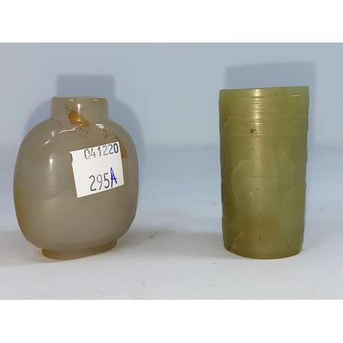 295a - A Chinese jade coloured cylindrical item with hole to middle and a carved hard stone snuff bottle (n... 