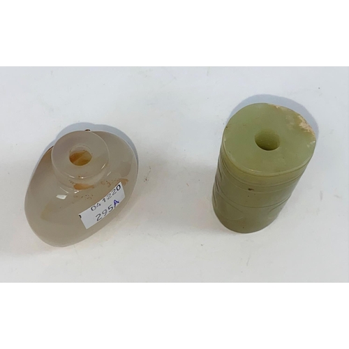295a - A Chinese jade coloured cylindrical item with hole to middle and a carved hard stone snuff bottle (n... 