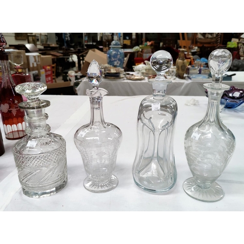 210 - A mallet shaped cut decanter with silver rim; an hourglass decanter; 2 Victorian etched decanters
