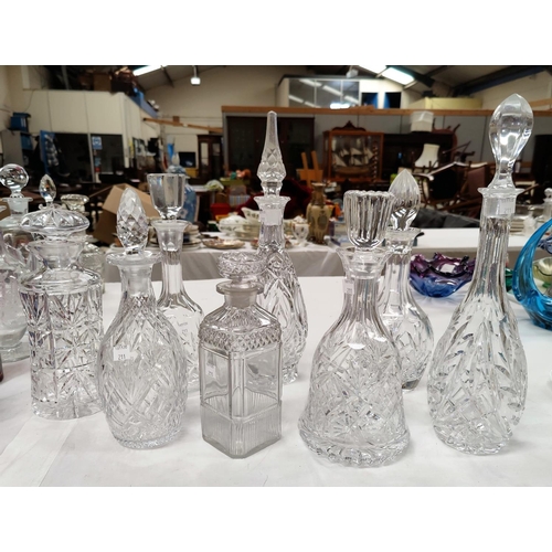 211 - Eight various cut glass decanters