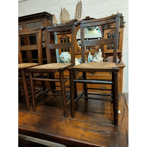 490 - A 19th century set of 6 chapel chairs with rush seats