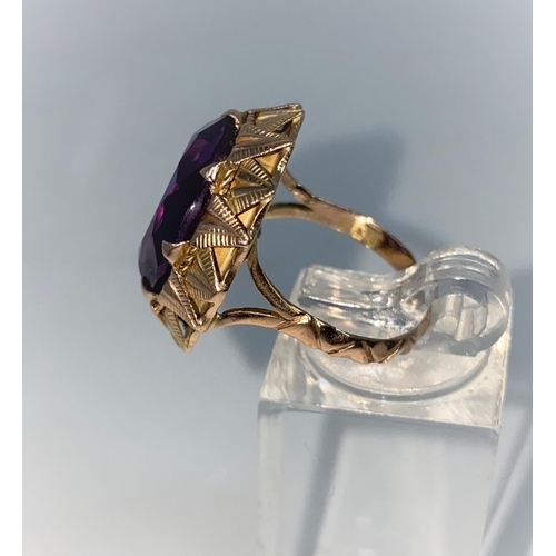 371 - A yellow metal dress ring set with circular facetted amethyst, Middle Eastern marks, tests as 14 car... 