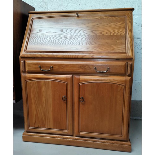 518 - A vintage teak bureau with fitted interior, single drawer and double doors