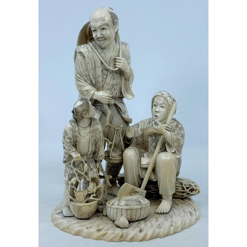 284A - A finely carved late 19th / early 20th century Japanese ivory family group of fisher folk, the man h... 