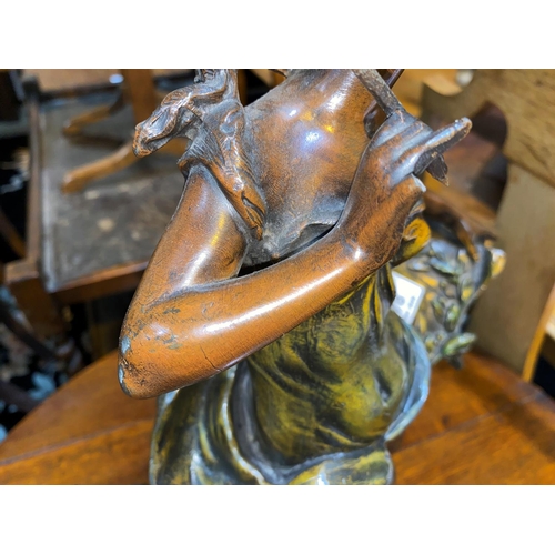 478 - An Art Nouveau patinated spelter figure of a young woman with pen and scroll, height 47cm (finger a.... 