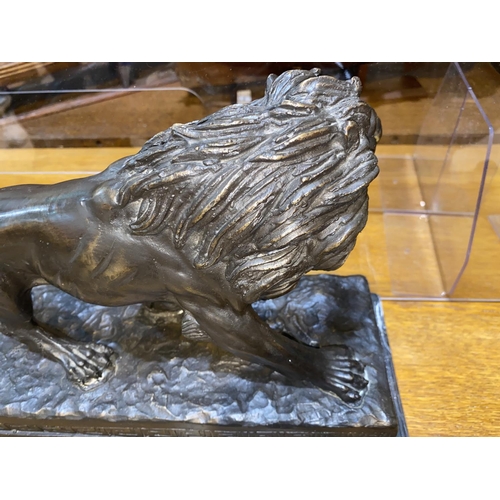 479 - After Barge, a modern bronze depicting a lion on marble plinth, length 37cm