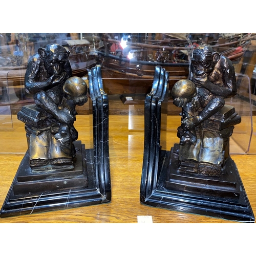 480 - A pair of modern bronze and marble monkey and skull 'Evolution' book ends, height 23cm