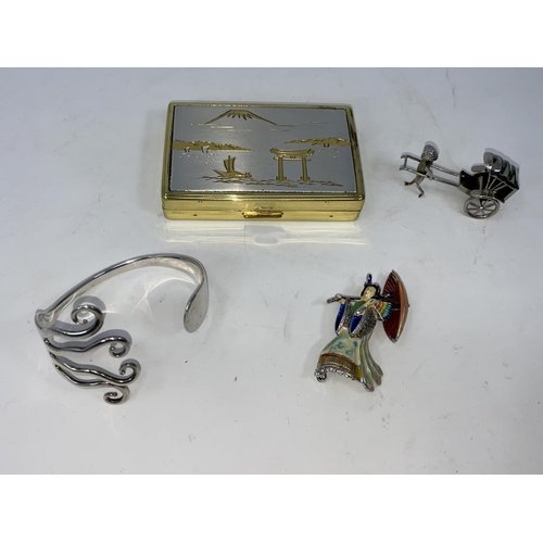 403 - A hallmarked silver bangle; a brooch in the form of a Japanese geisha; a Japanese musical box; etc.